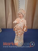 A collectable German bisque figurine number 32.