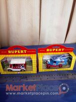 Two collectable diecast model of Rupert the bear.