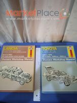 Two books of lancia and Toyota workshop manual.